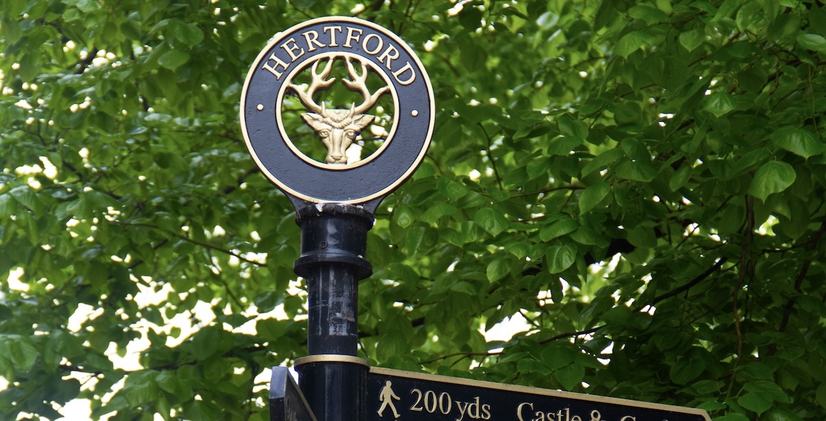 A close up of a sign pole in Hertford