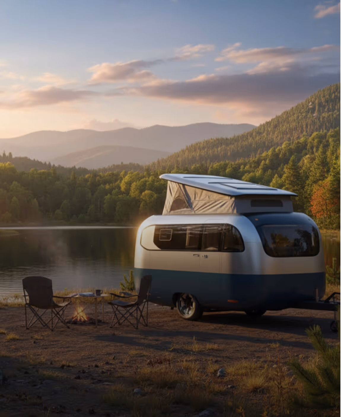A modern recreational vehicle with sleek silver and blue coated aluminium exterior siding, parked next to a mountain lake at dusk.