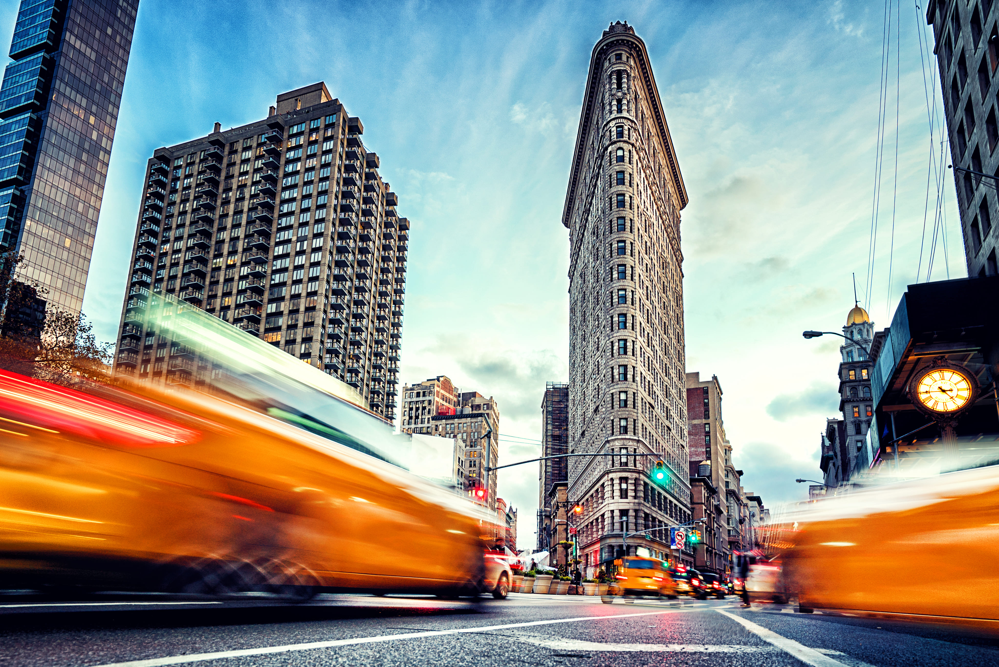 Yellow taxis passing through Midtown Manhattan.