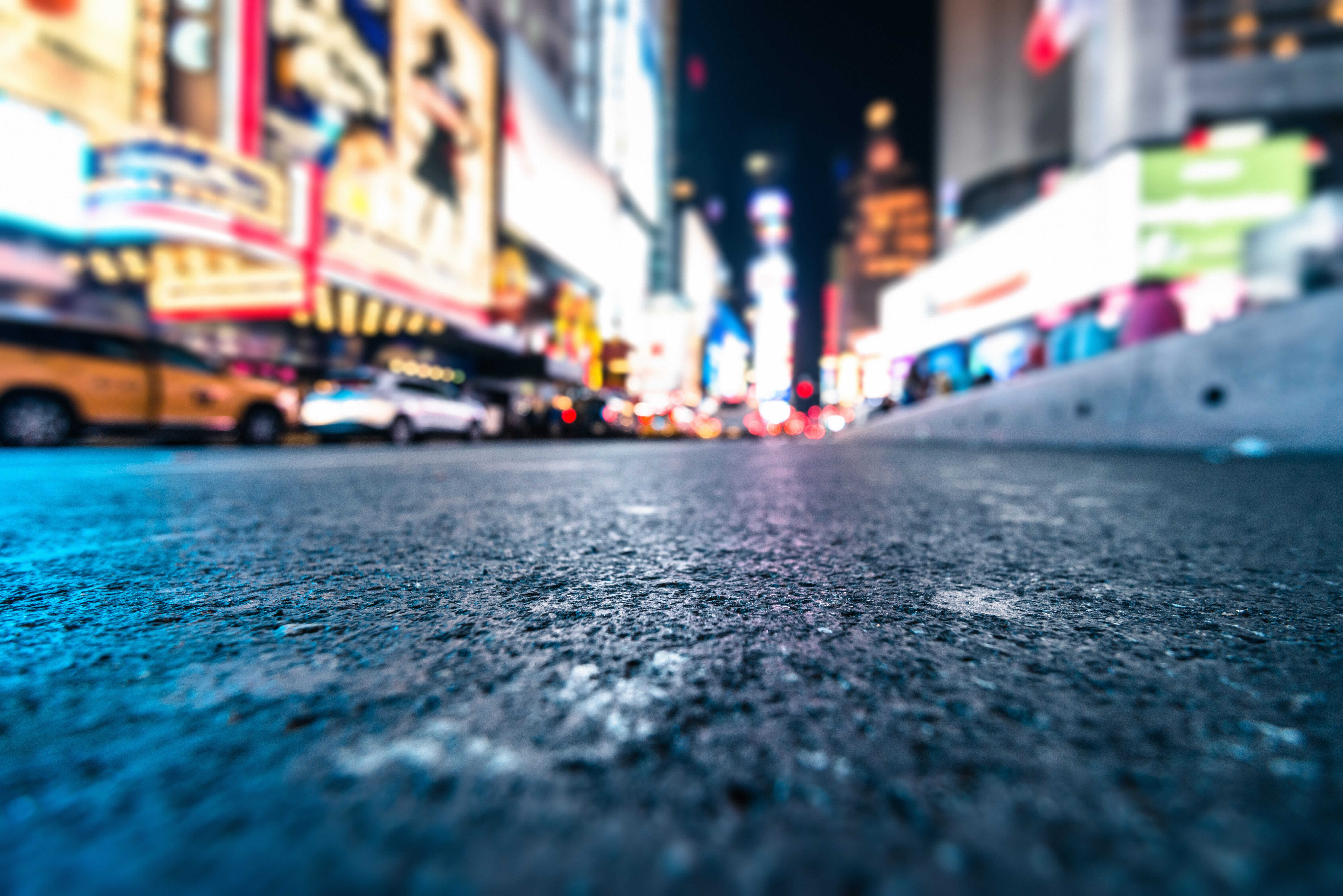 Street-level view of Times Square at night in New York City.