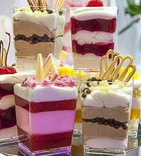 Display counter featuring an assortment of cakes and pastries in a café
