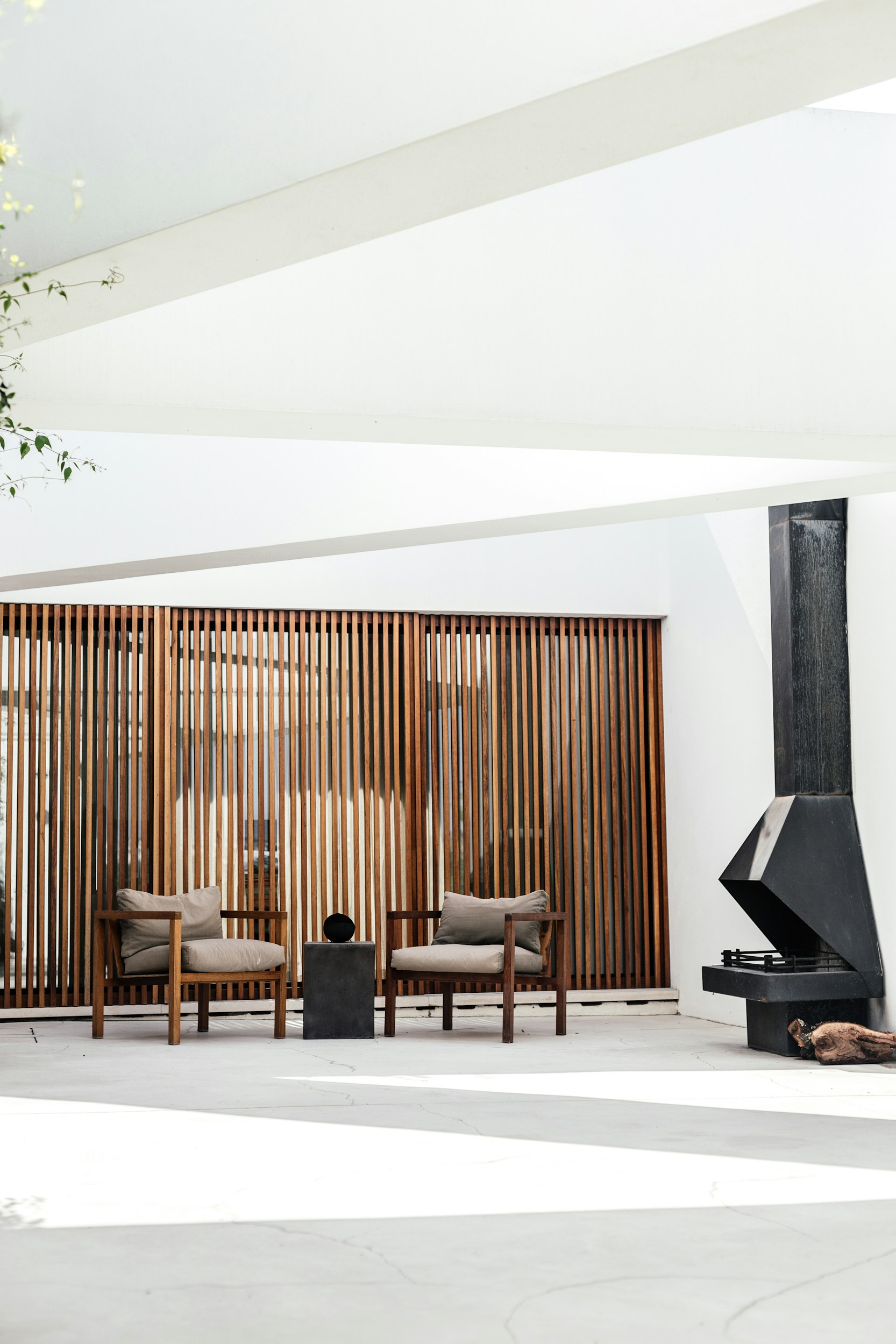 Contemporary interior featuring warm timber screens and refined architectural details.