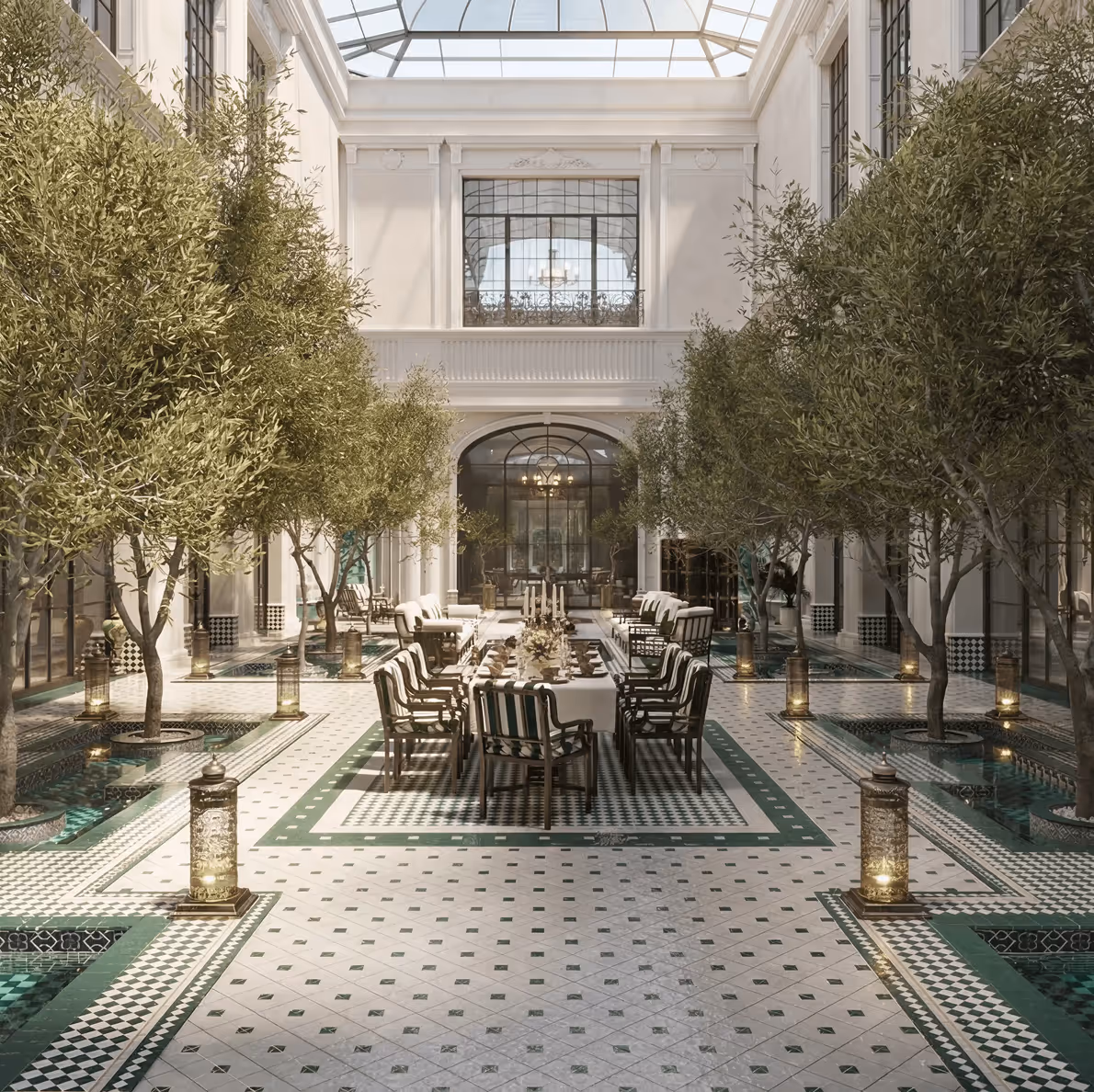 Indoor courtyard garden with dining area and mosaic floor by Emkaan
