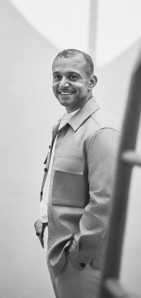 Black-and-white portrait of an Emkaan team member