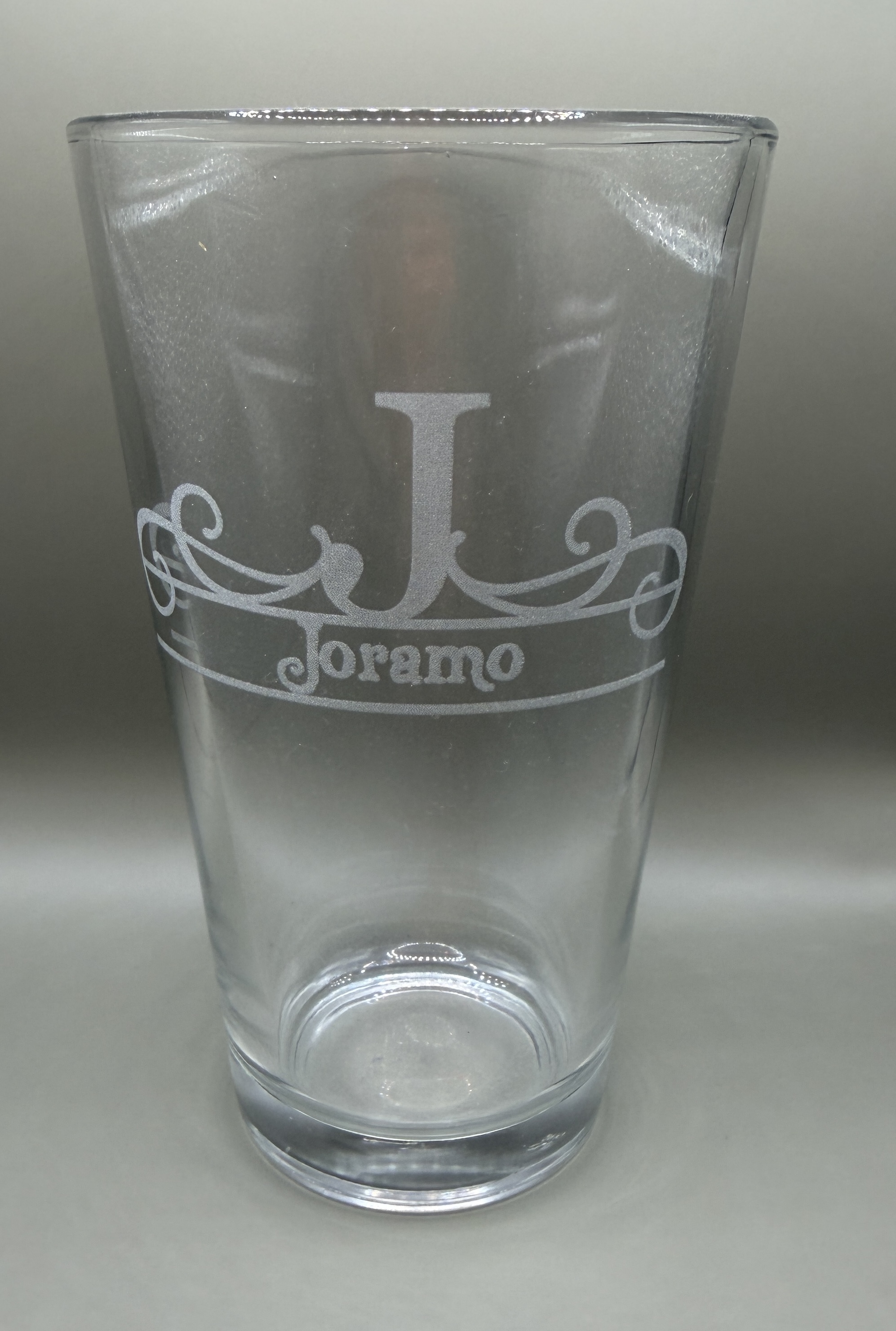 Etched pint glass with a personalized family monogram