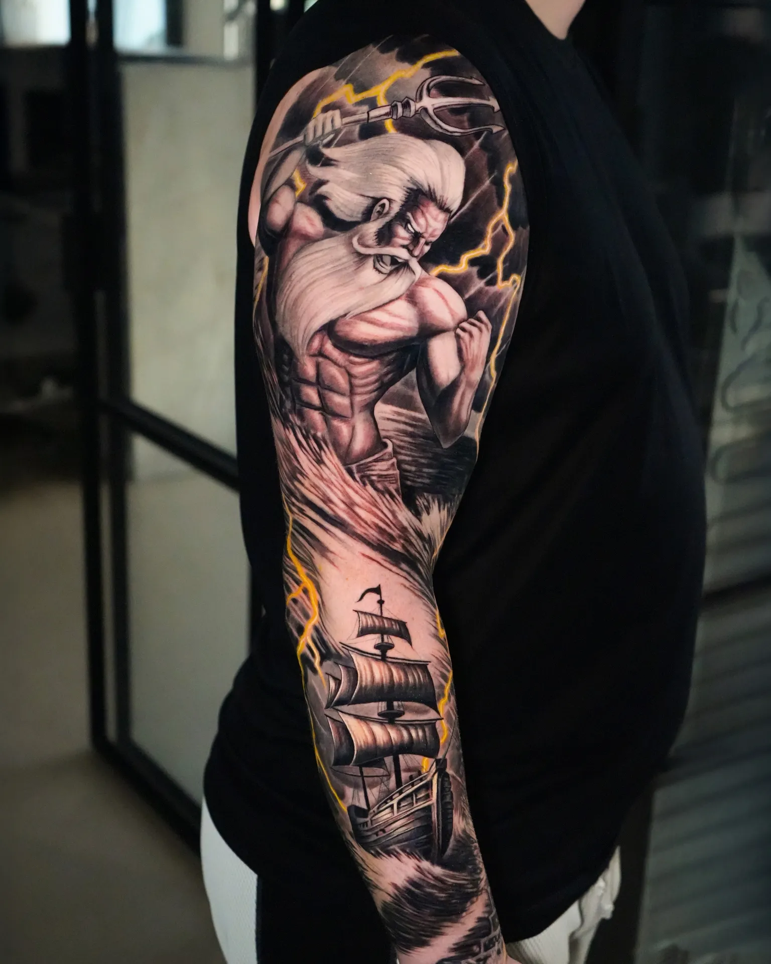 Full sleeve in black and grey realism by Raza Tattoo in Aarhus 