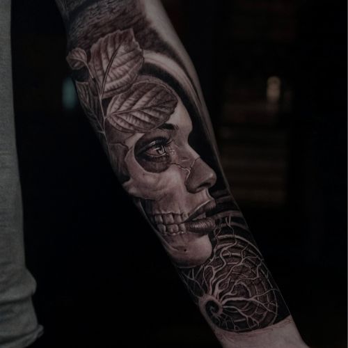 Female skull tattoo in Black and grey realism by Raza Tattoo in Aarhus Denmark 
