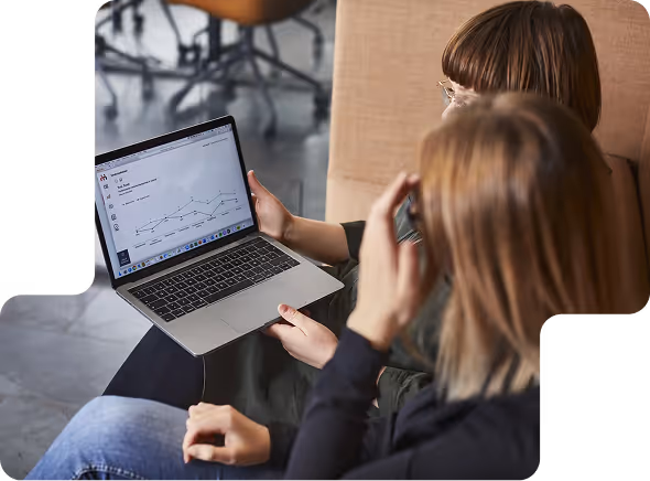 Two girls looking at motivati on computer