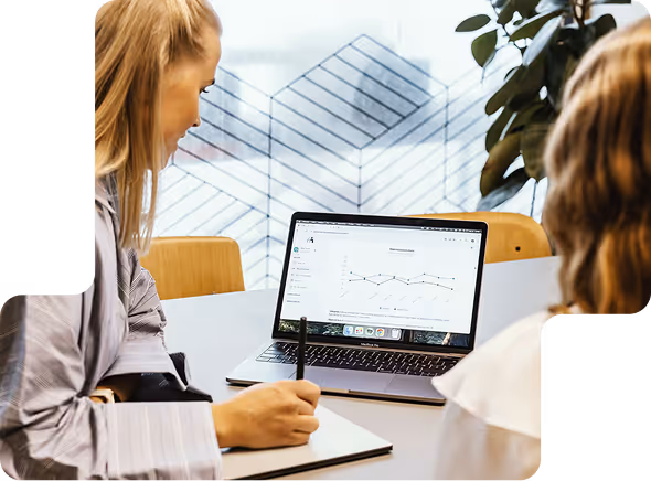 Two girls looking at motivati on computer
