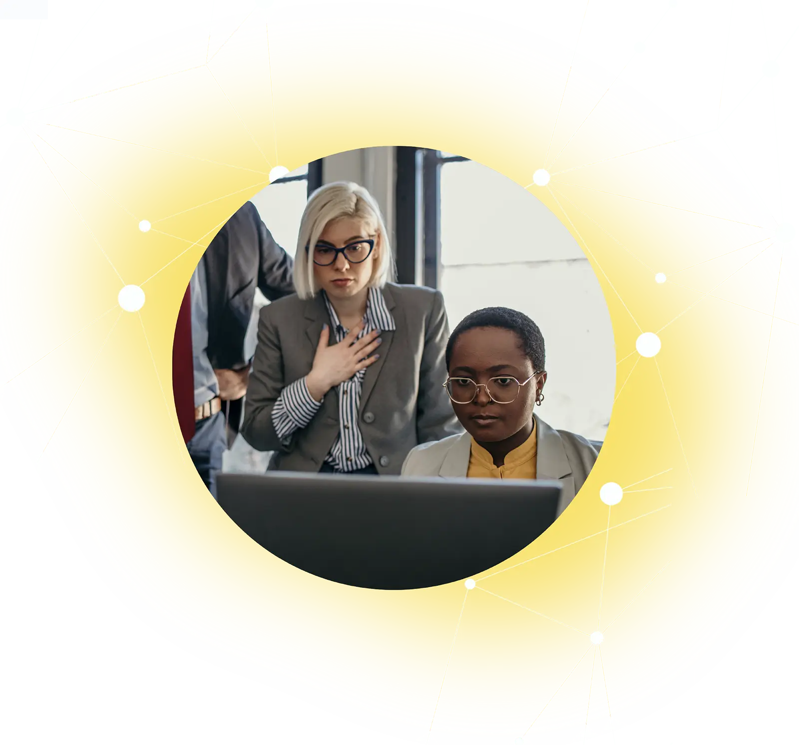 Two professional women focused on a laptop screen in an office with a yellow network graphic overlay.
