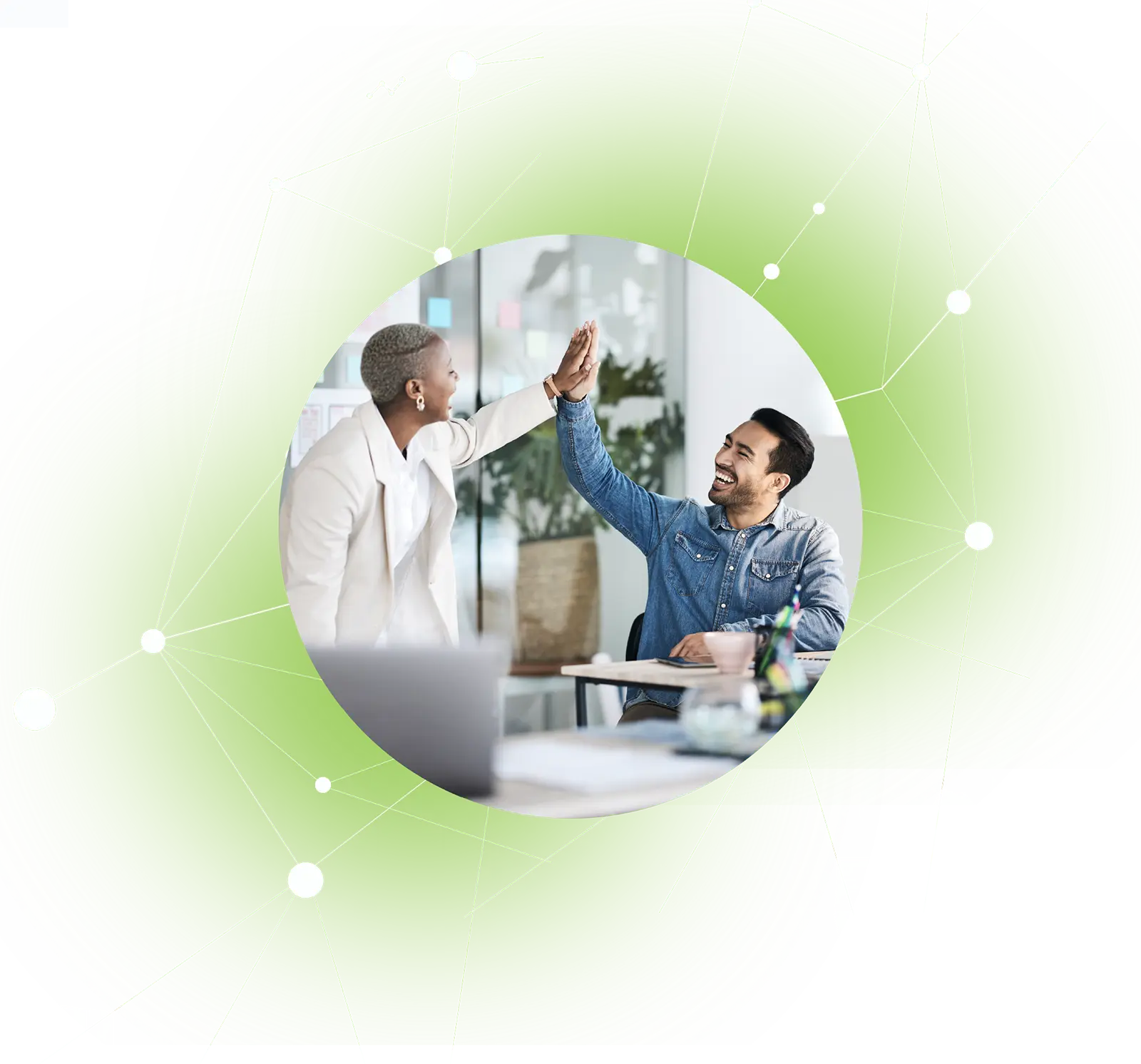Two colleagues exchanging a high-five in an office setting, smiling and celebrating success.