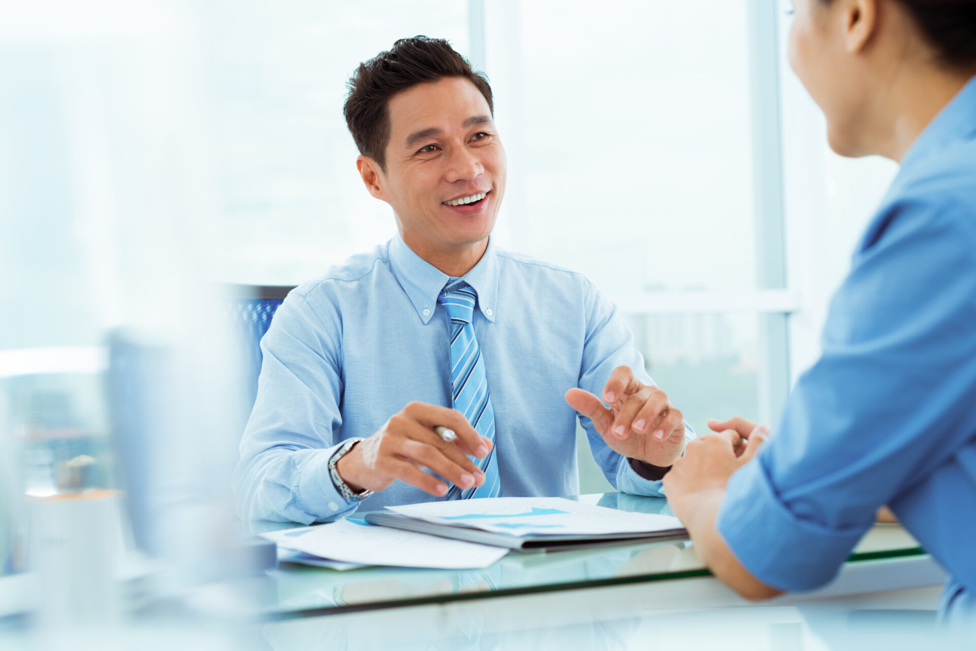 Hiring manager reviewing candidates at his desk