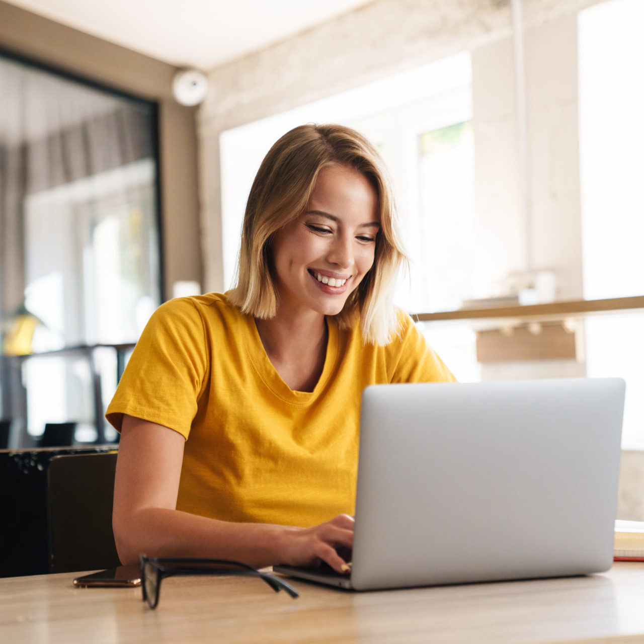 Smiling hiring manager holding a tablet