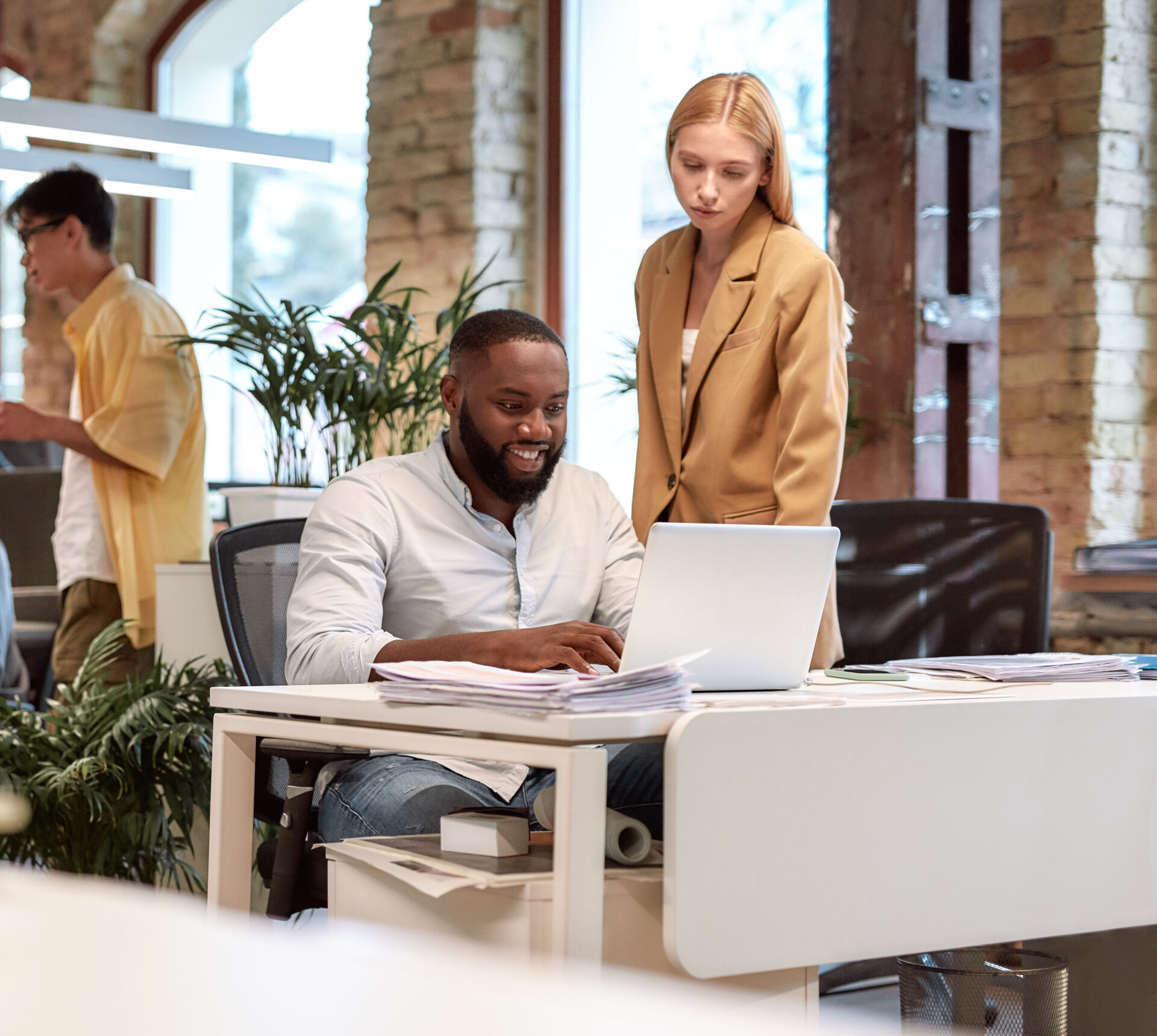 Hiring manager reviewing applications at a desk