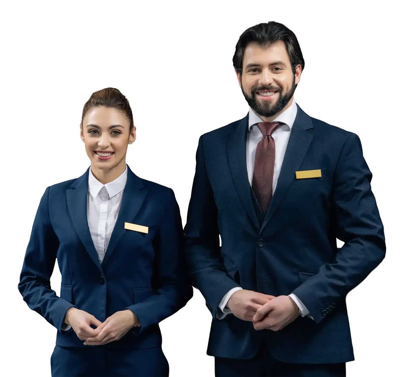 Smiling man and woman in navy suits with blank name tags on a white background.