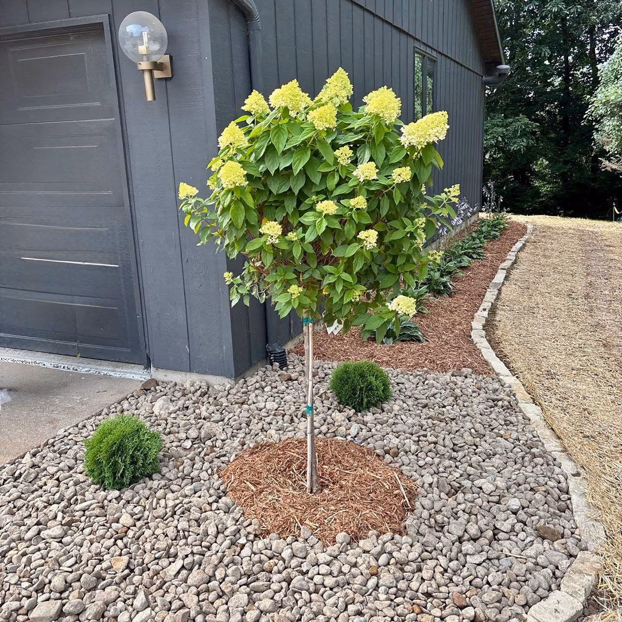Landscape design with trees, shrubs, and decorative rock | Elite Outdoor | Quincy, Illinois

