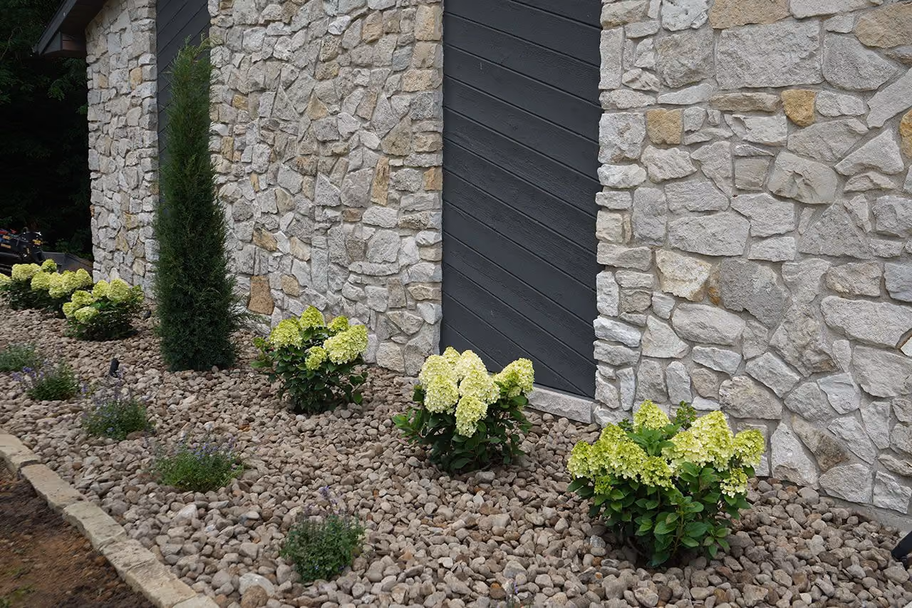 Residential landscaping with trees, shrubs, and mulch | Elite Outdoor | Quincy, Illinois
