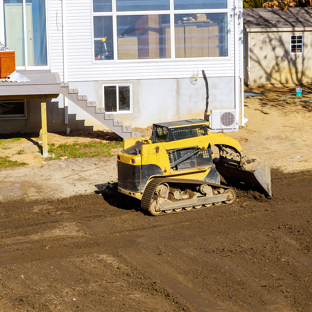 Professional grading for improved residential property drainage
