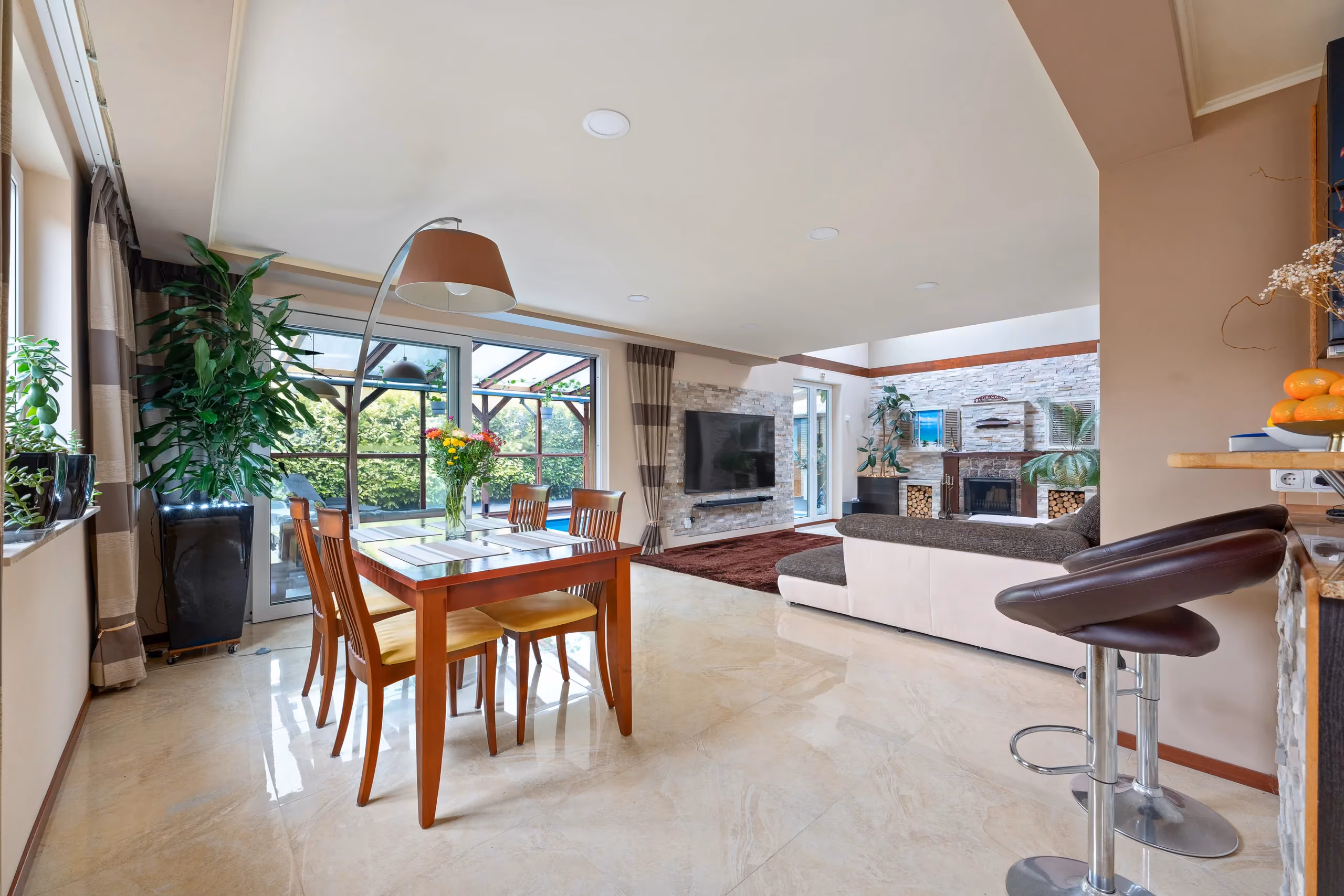 Bright dining area with large windows in a renovated home