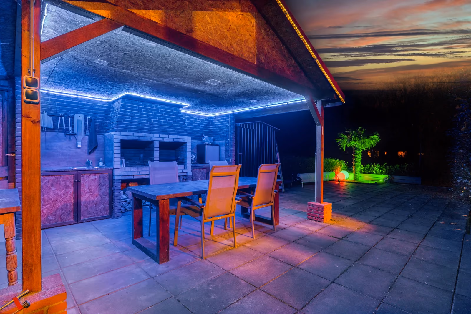 Lounge with blue accent lighting in a renovated home