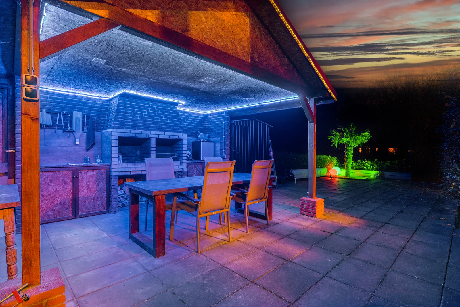 Lounge with blue accent lighting in a renovated home