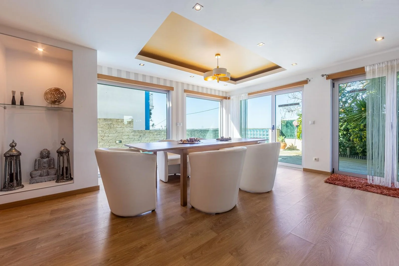 Open-plan living and kitchen area in a renovated villa