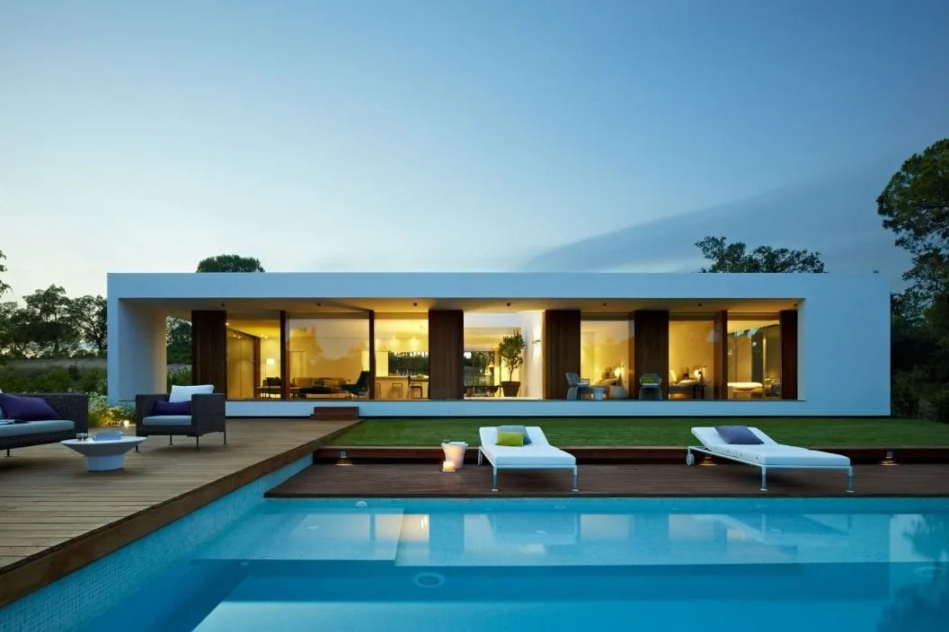Modern Mediterranean villa with a pool among palm trees