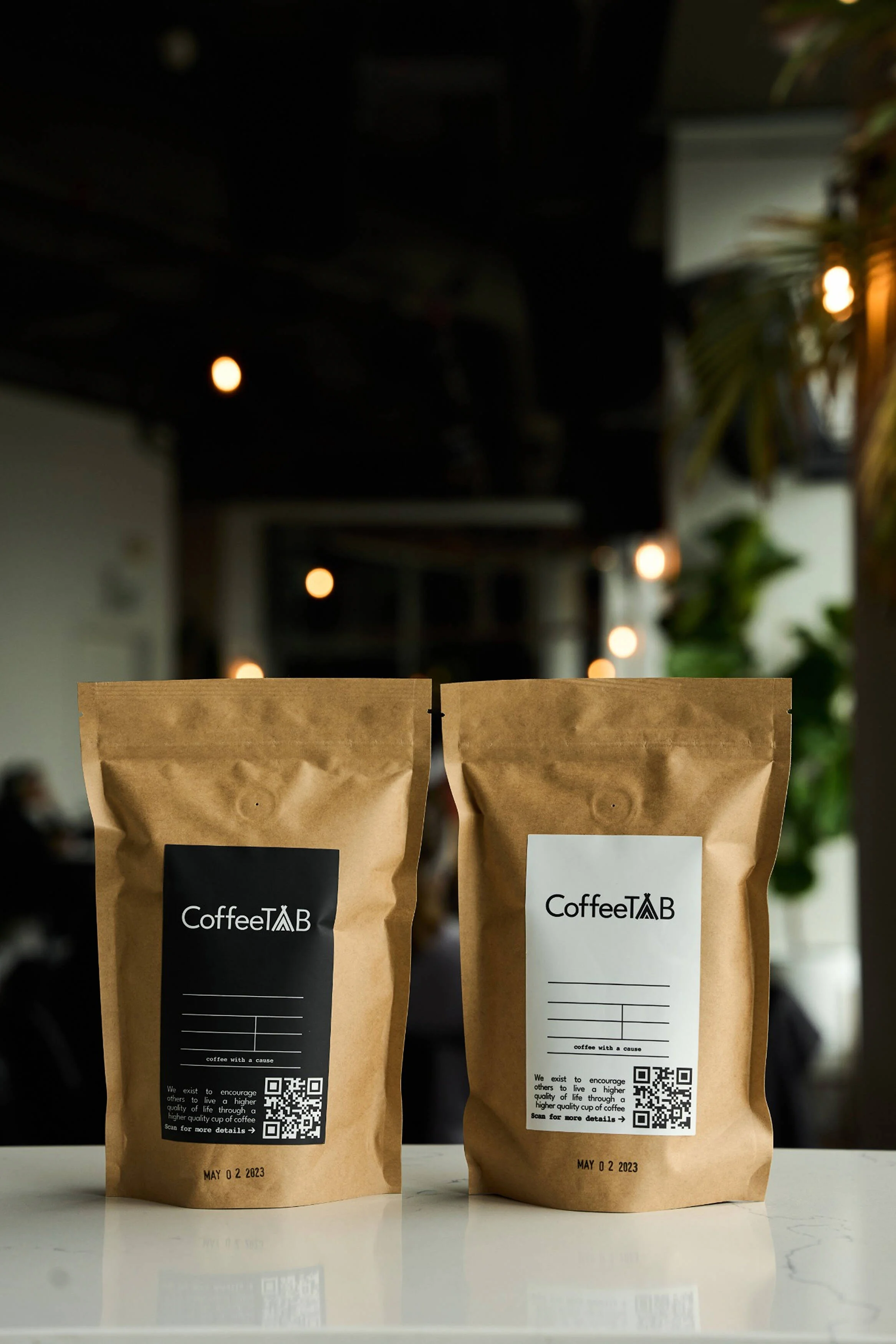 Two bags of Coffee with the logo Coffee TAB