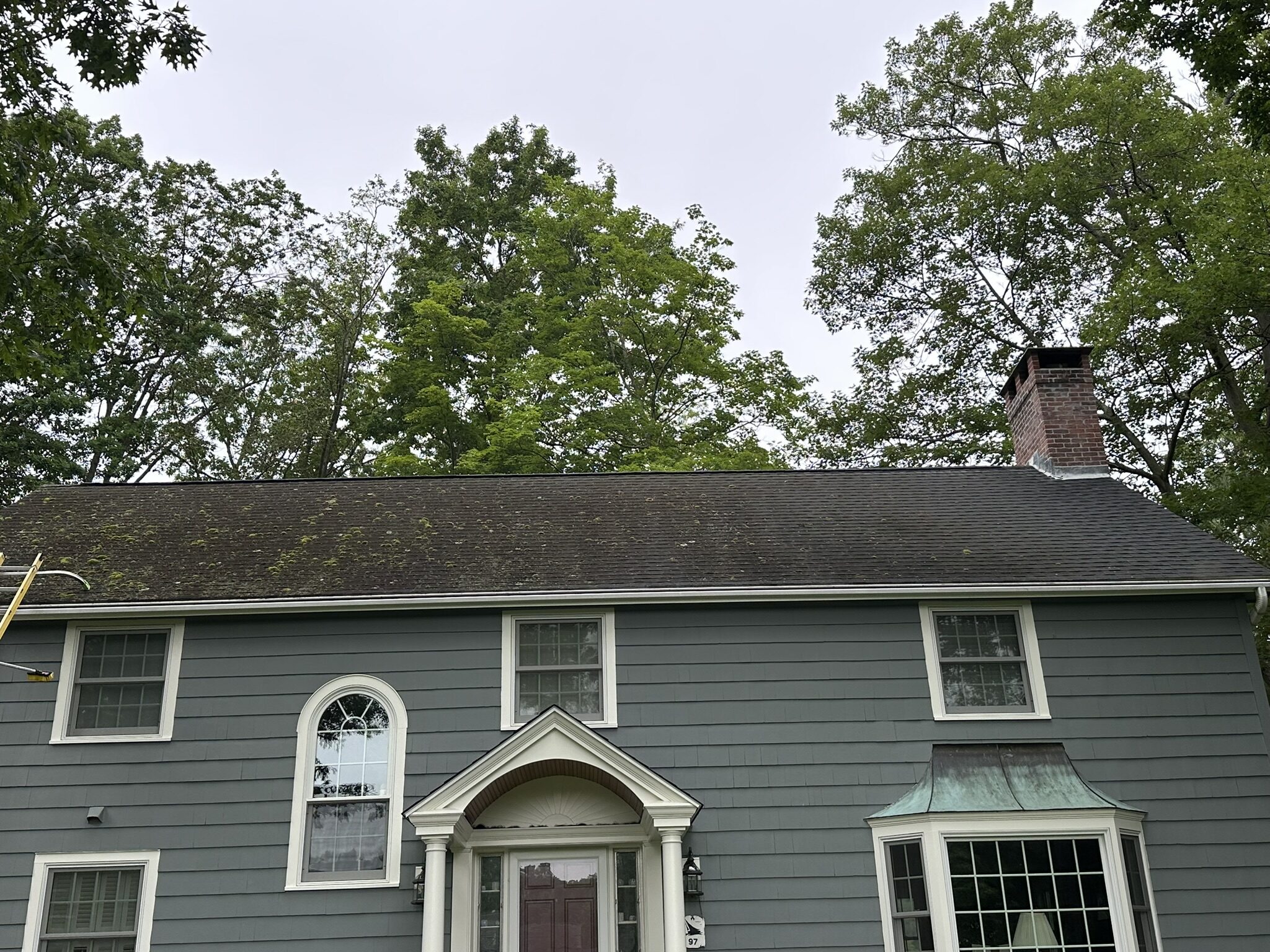 Gray home with stone front in Vernon, CT