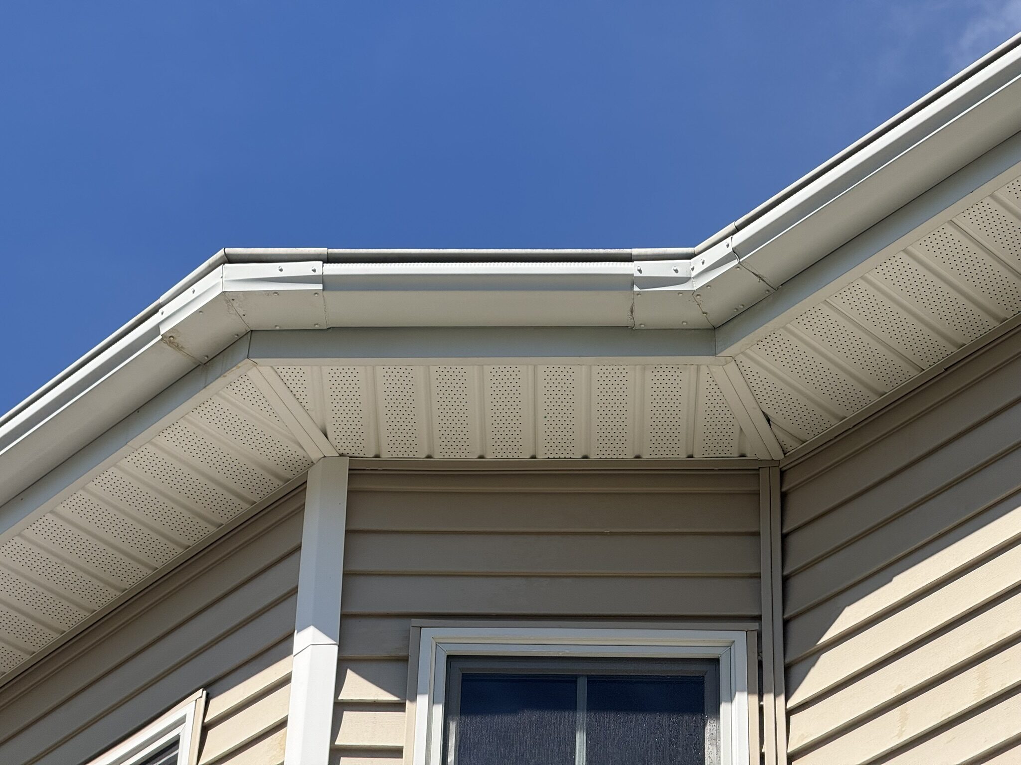 Clean white gutters and soffit after exterior brightening