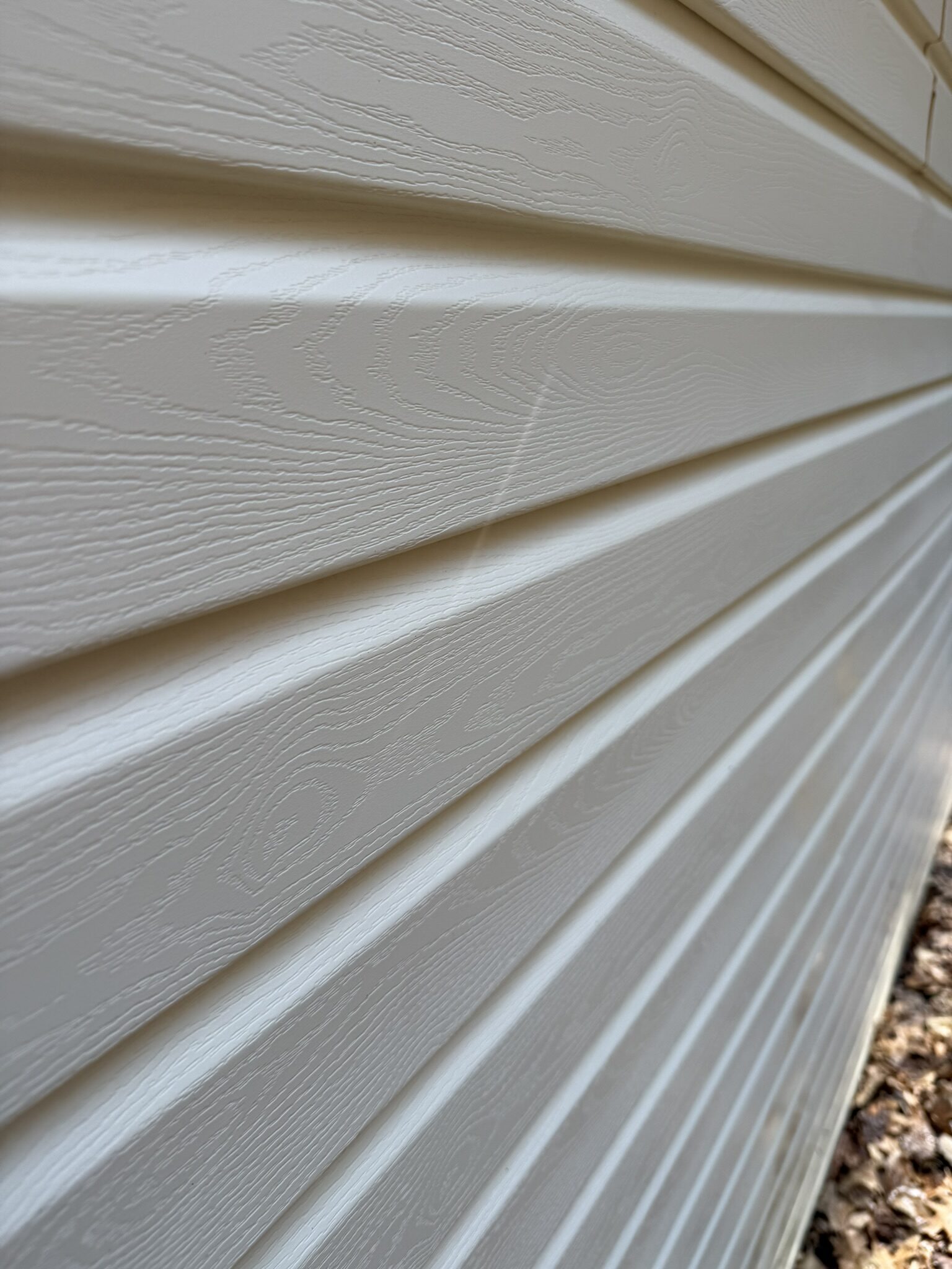Close-up of clean siding after soft wash cleaning