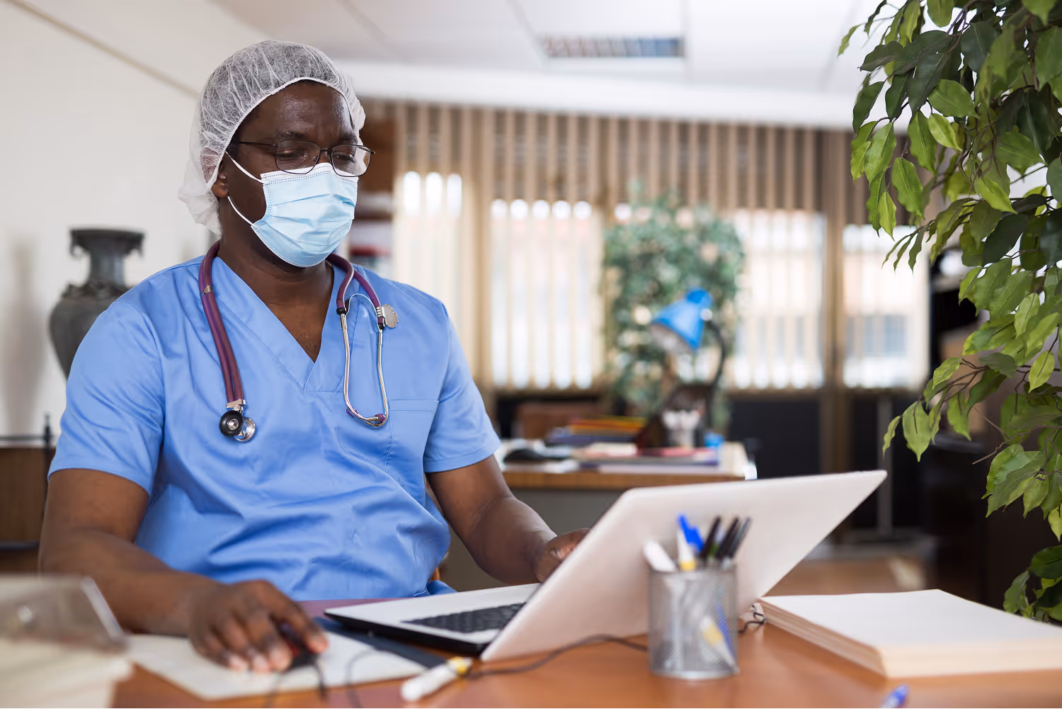 Healthcare professionals reviewing compliance and outcome measure data in value-based enterprises