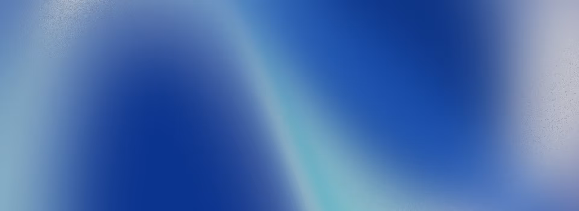 Abstract blue gradient background with smooth transitions of lighter and darker blue tones.