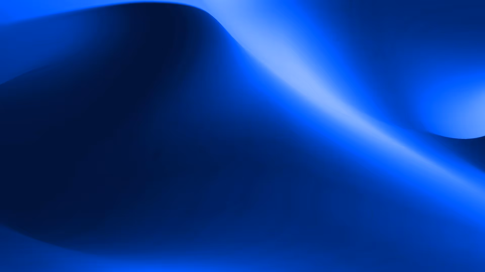 Abstract smooth gradient blending dark and bright blue shades with soft curved shapes.