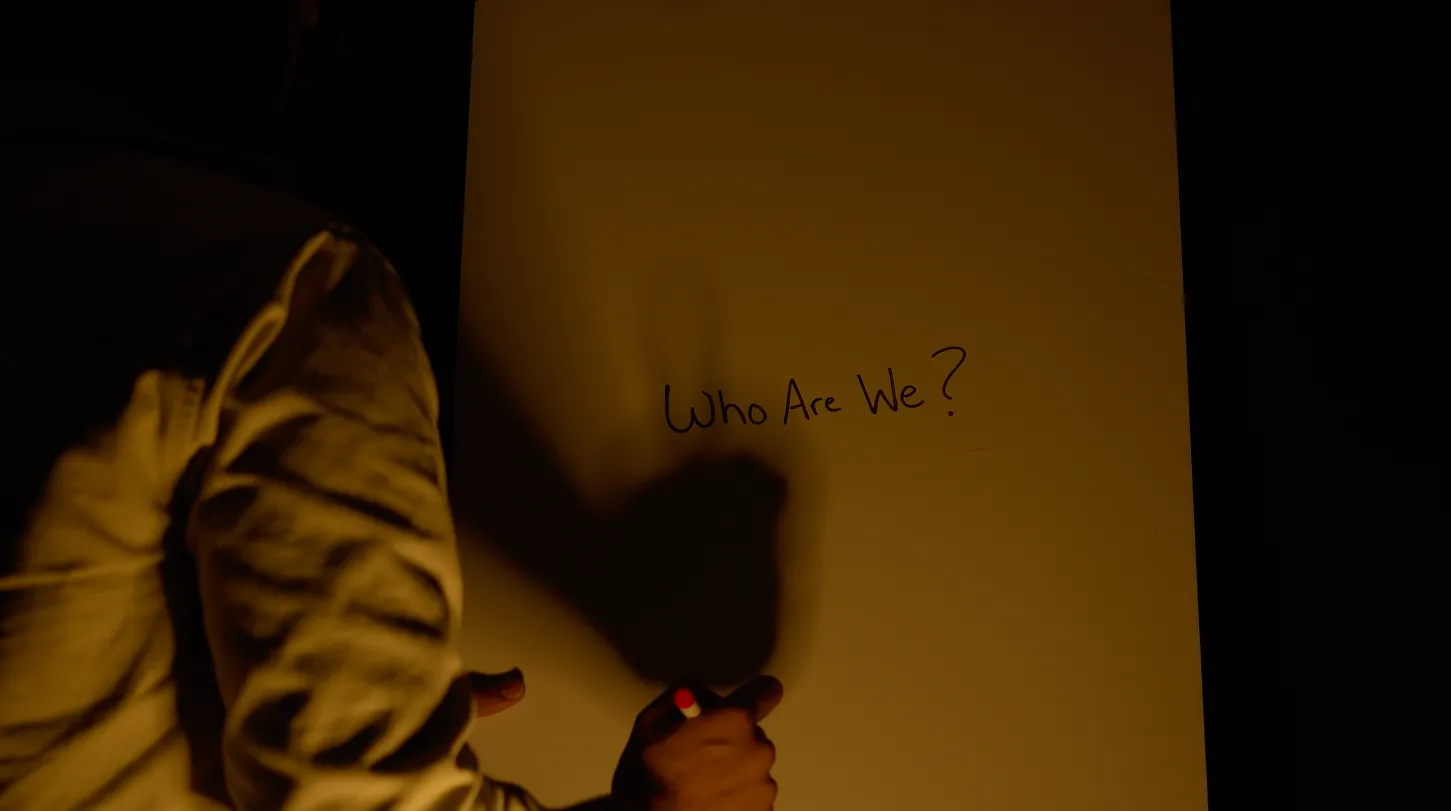 Man brainstorming branding ideas by asking "who are we?"