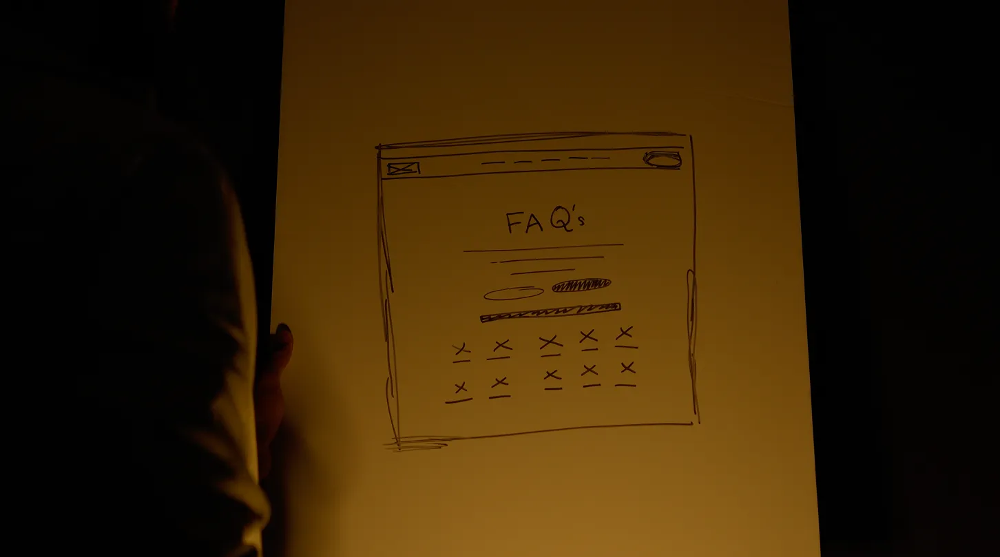 Man drafting website user interface on a whiteboard.