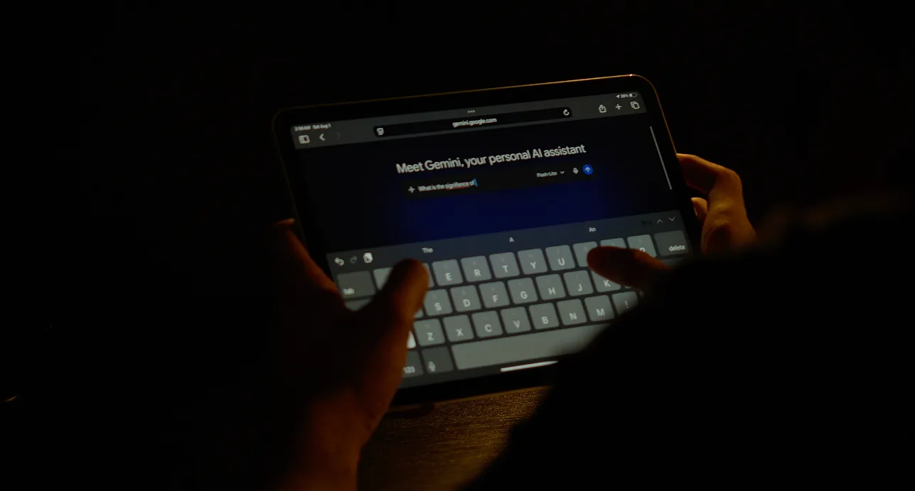 Man conversing with Google's Gemini on his tablet.