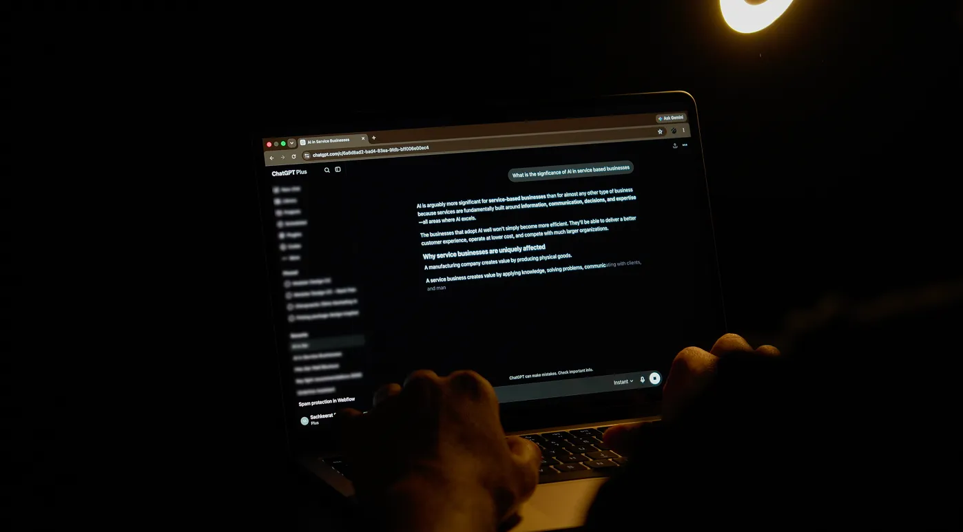 Man brainstorming ideas with an AI LLM on his laptop.