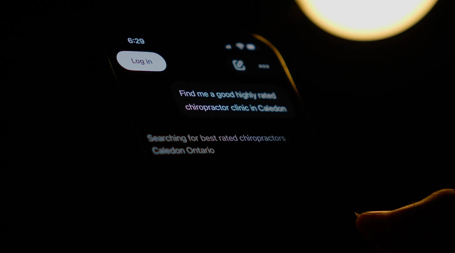 Man asking an AI LLM on his phone to recommend businesses near him.