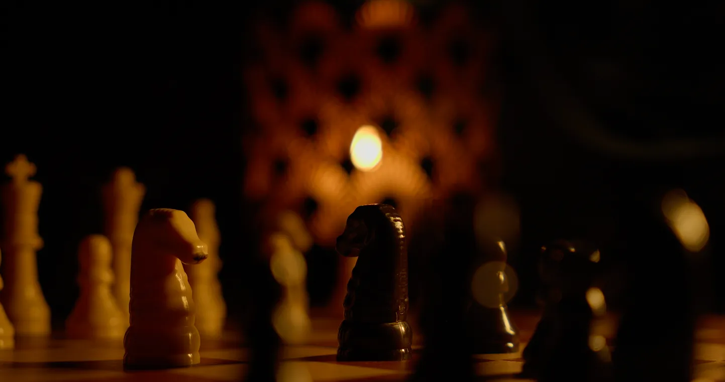 Chess game in progress on a chess board.