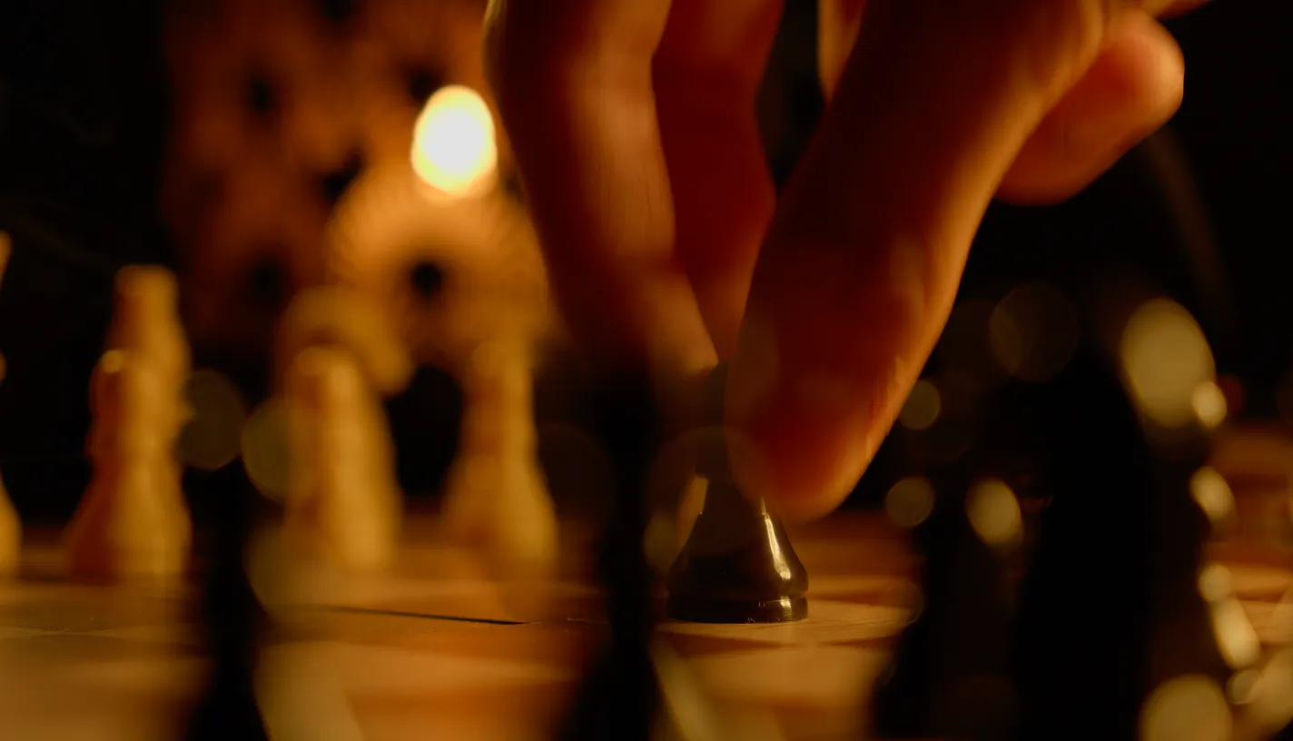 Chess game in progress on a chessboard.