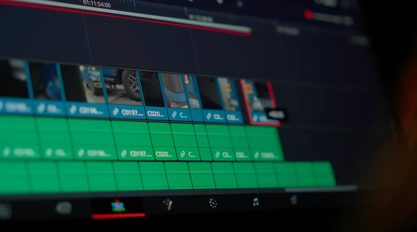 Video being edited for content on a laptop.