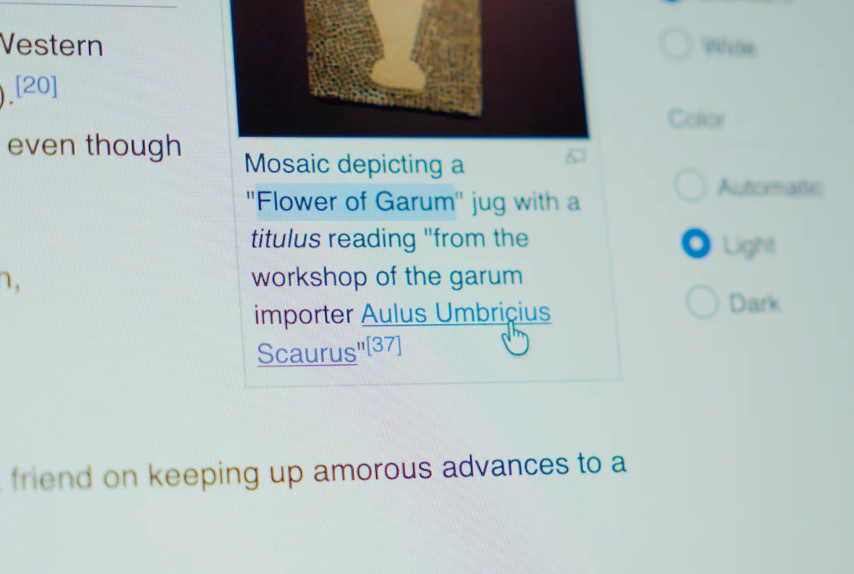 Online article being highlighted on a laptop.
