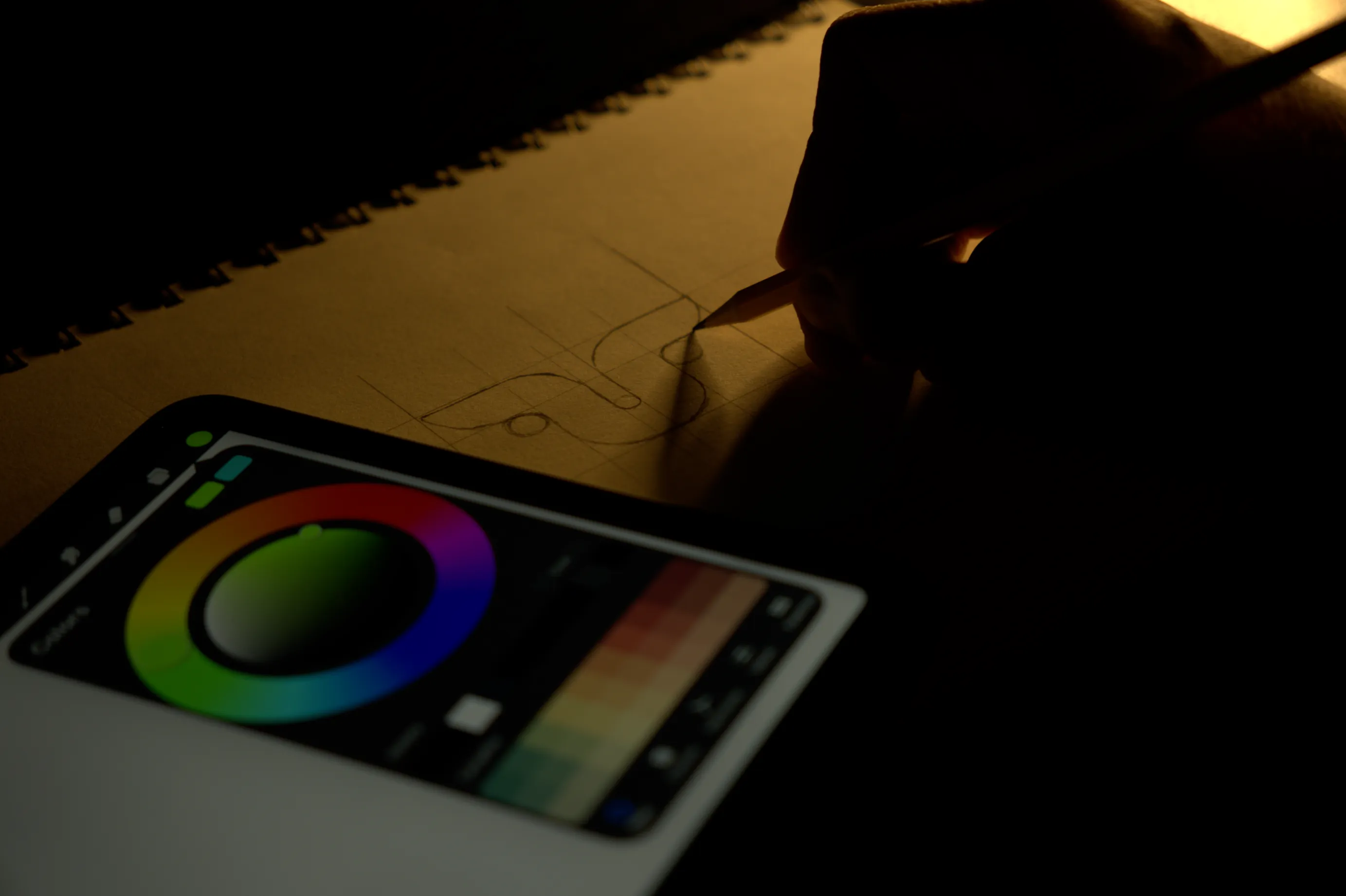 Man using colour wheels to brainstorm branding ideas for his business.