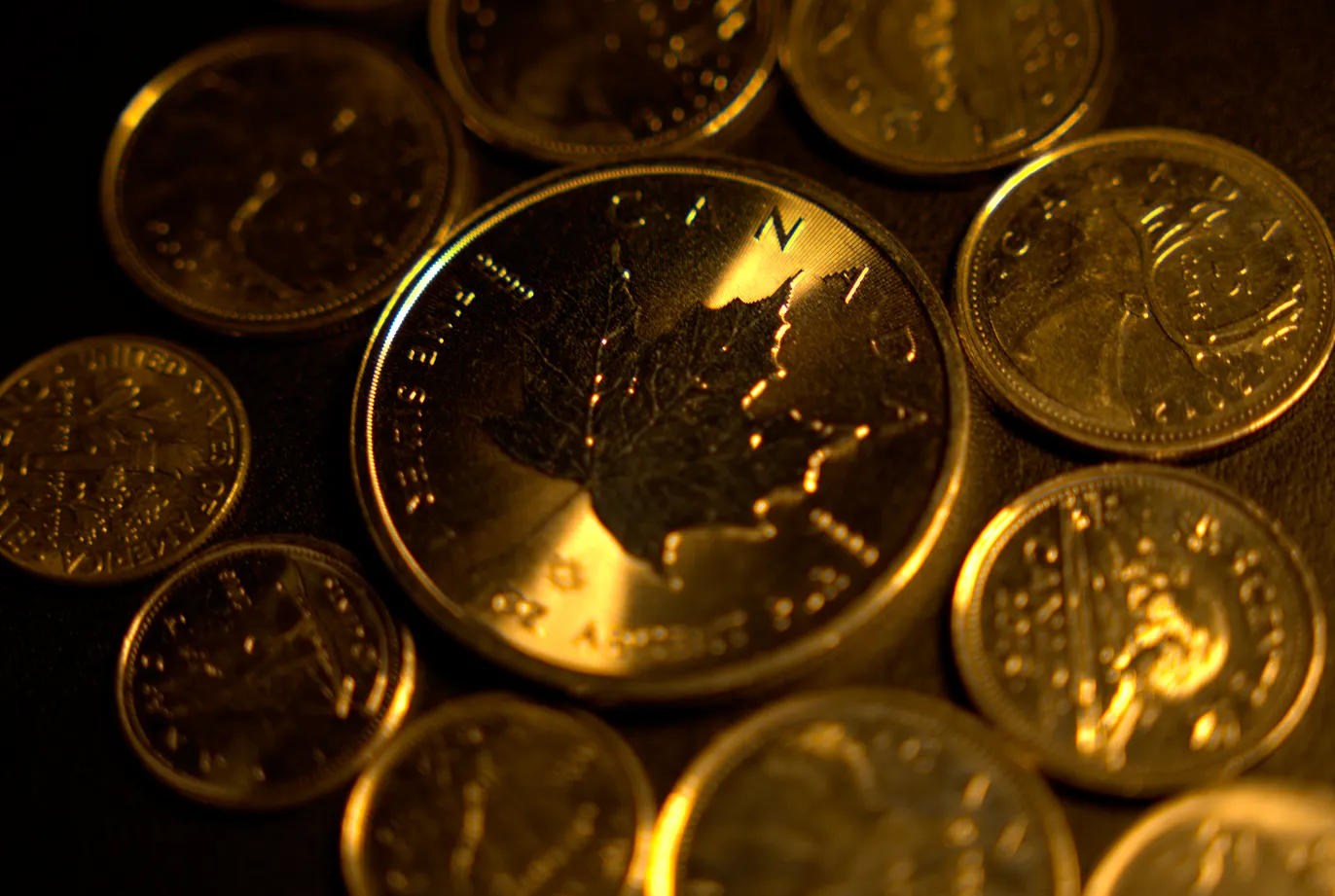 Coins spread out on a table.