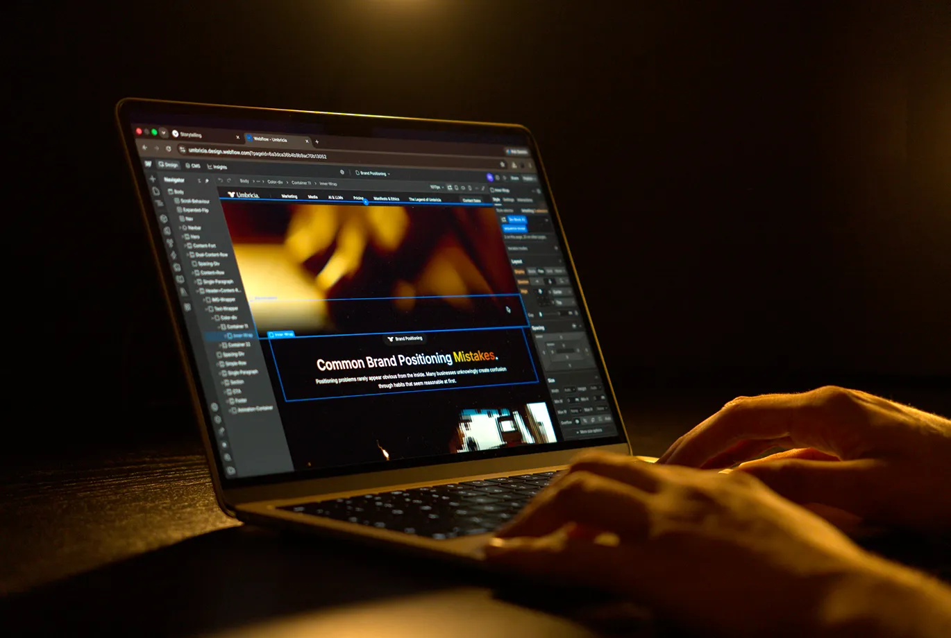 Man developing a website using Webflow on his laptop.