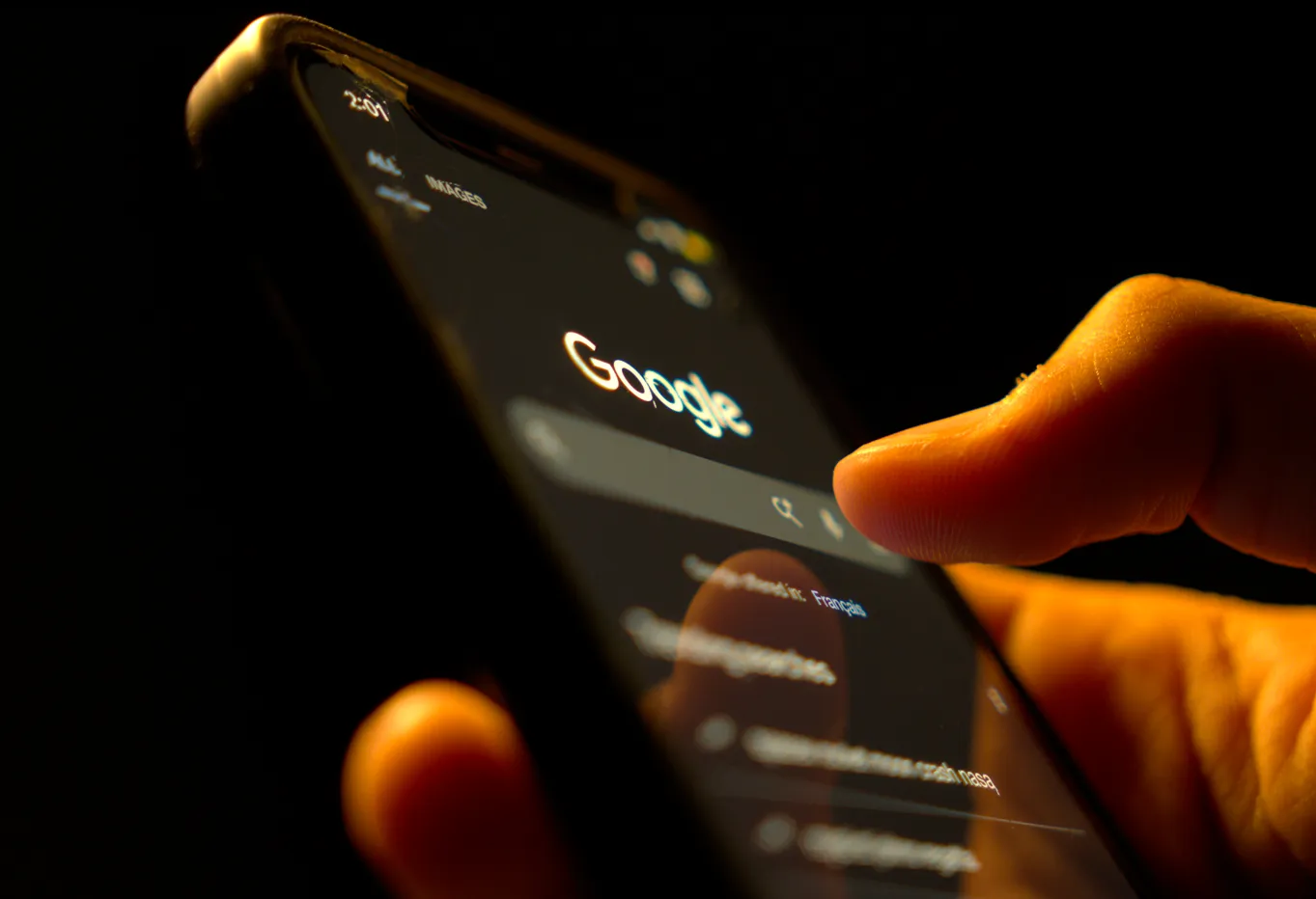 Man using google search on his phone.