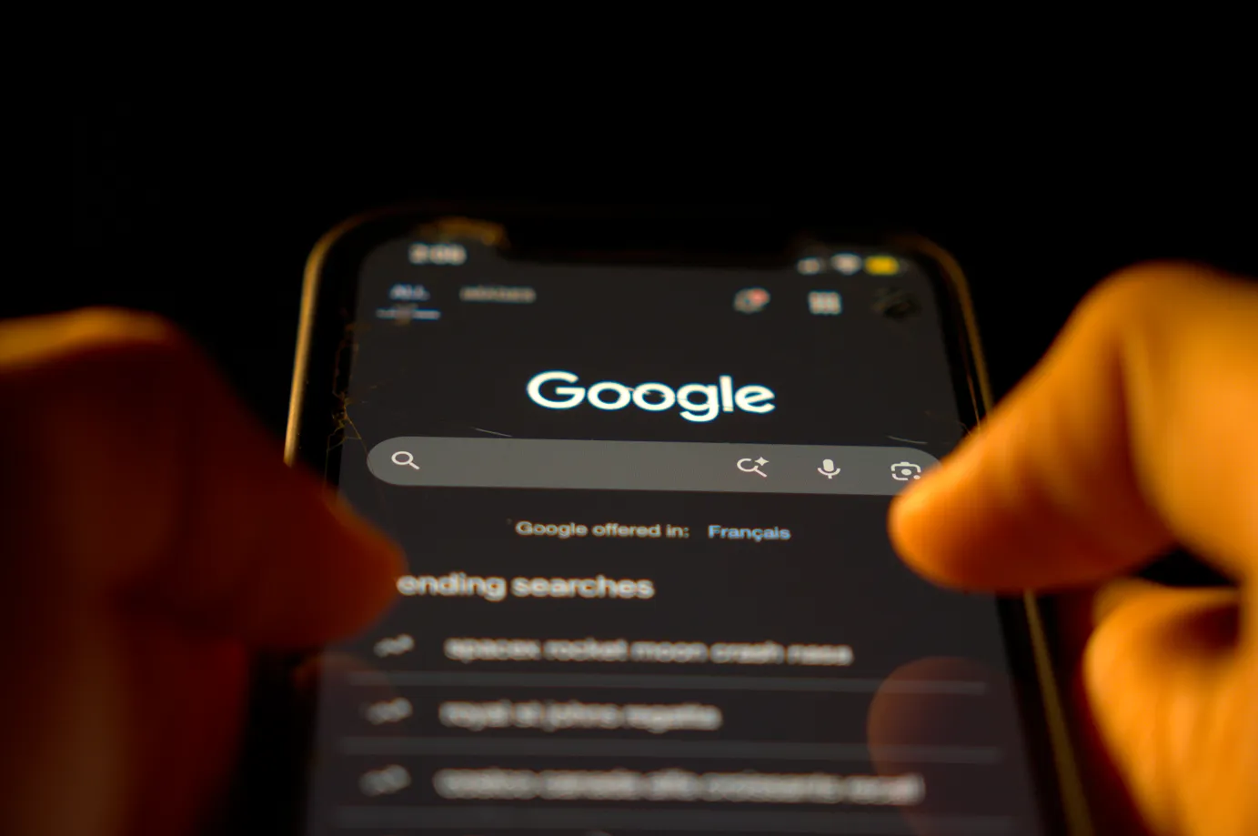 Man using google search on his phone.