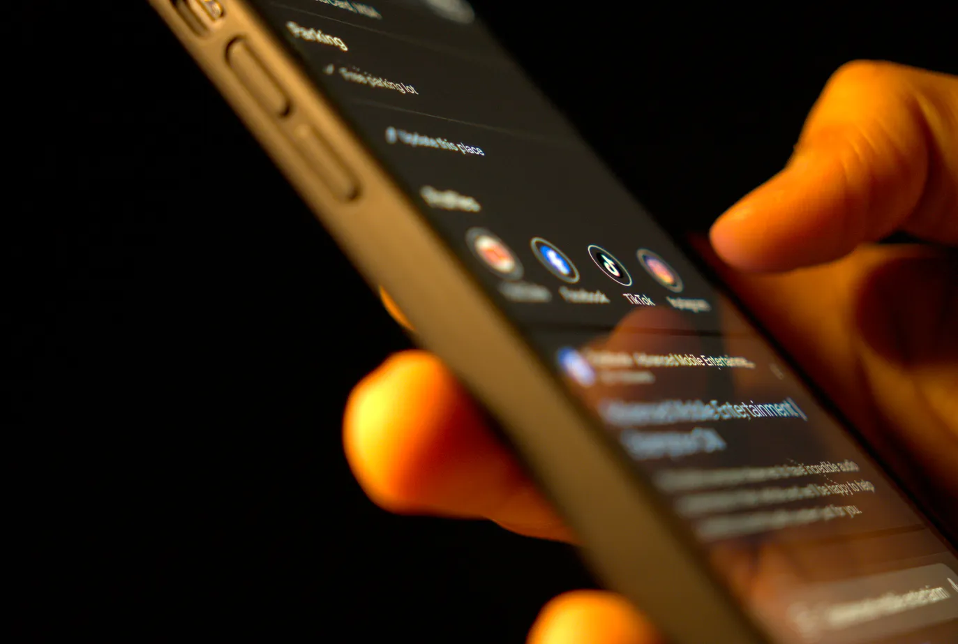 Man reviewing social media connections listed on a google business profile on his phone.