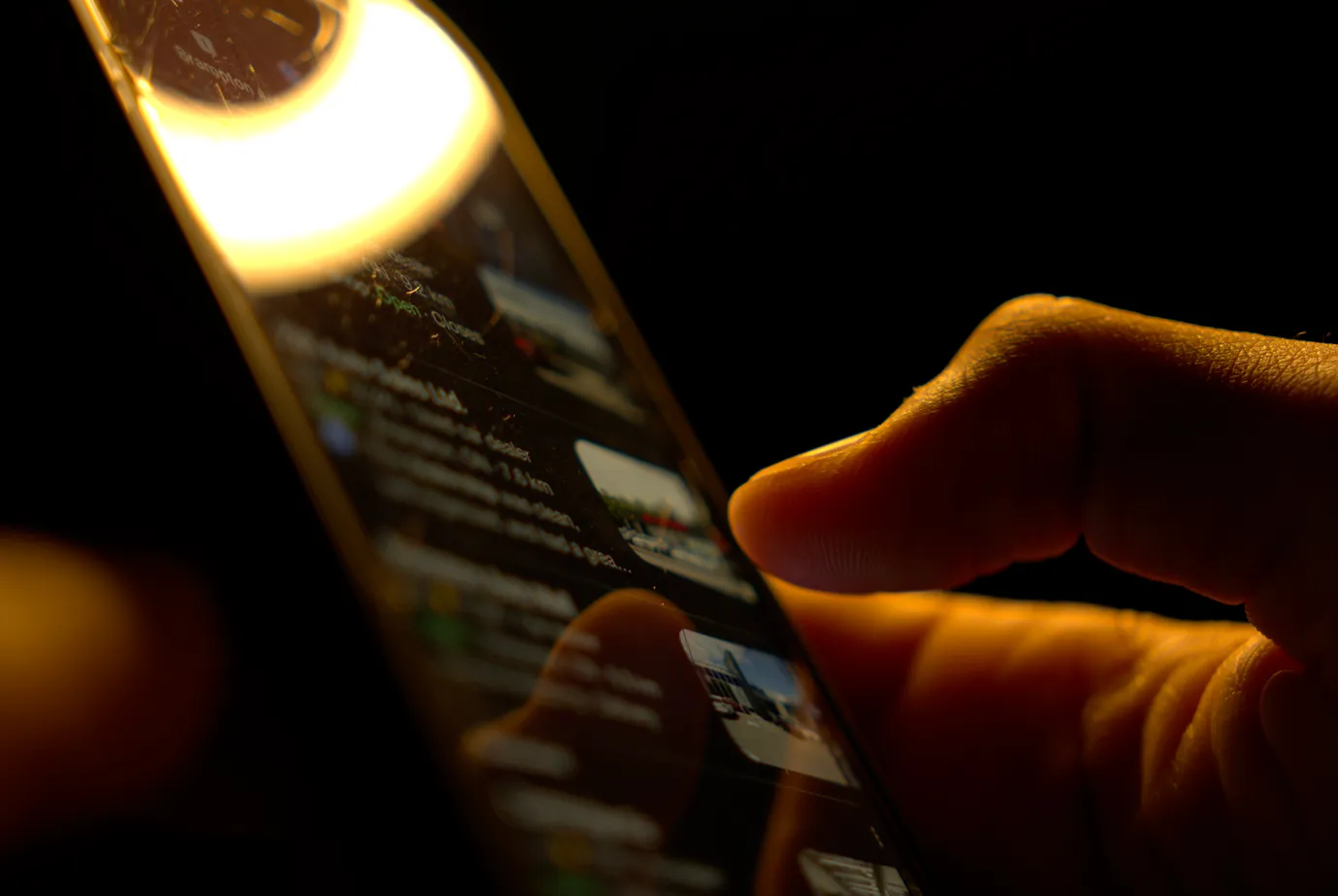 Man reviewing a list of a google business profiles on his phone.